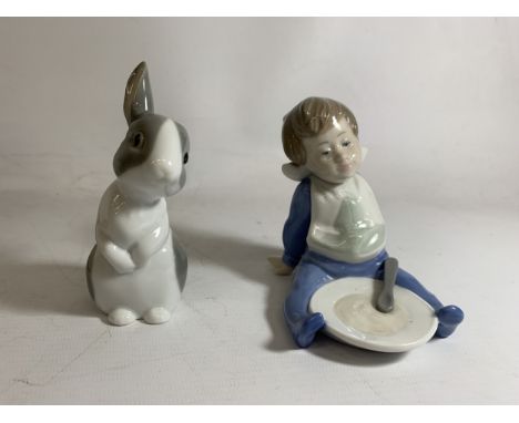TWO NAO FIGURES ONE OF A RABBIT "PATCHES" (WITH BOX) AND THE OTHER OF A BABY BOY EATING PORRIDGE