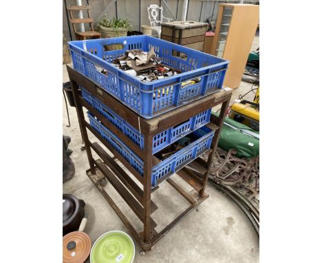 A METAL FOUR WHEELED WORKSHOP TROLLEY WITH AN ASSORTMENT OF TOOLS TO INCLUDE SOCKETS AND SPANNERS ETC