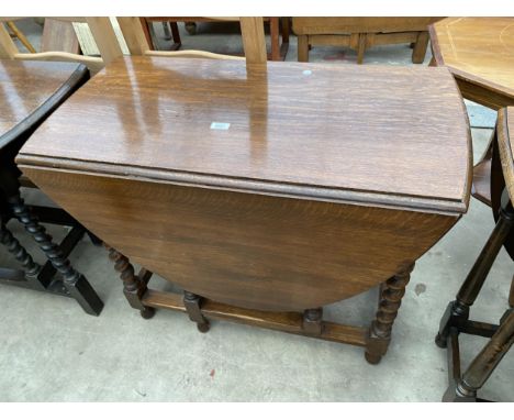 AN EARLY 20TH CENTURY OVAL OAK GATE-LEG TABLE ON BARLEY TWIST LEGS, 51" X 36" OPENED