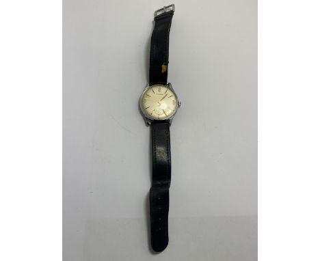 A VINTAGE GENTS HUGUENIN WRISTWATCH WITH STAINLESS STEEL FACE AND LEATHER STRAP