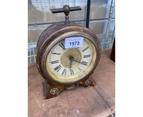 A DECORATIVE MAHOGANY MANTLE CLOCK