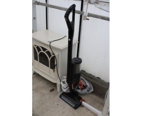 A MIELE STICK VACUUM WITH ATTATCHMENTS