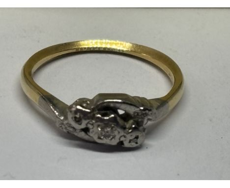 AN 18 CARAT GOLD AND PLATINUM RING WITH A TRILOGY OF DIAMONDS SIZE K IN A PRESENTATION BOX