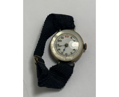 A VINTAGE LADIES WATCH WITH MOTHER OF PEARL INLAID FACE AND BACKWITH MATERIAL STRAP