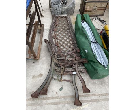 A PAIR OF CAST BENCH ENDS AND A CAST BENCH BACK