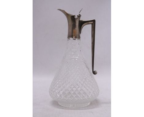 A HOBNAILED GLASS VINTAGE CLARET JUG WITH A HALLMARKED SILVER BIRMINGHAM SPOUT AND HANDLE