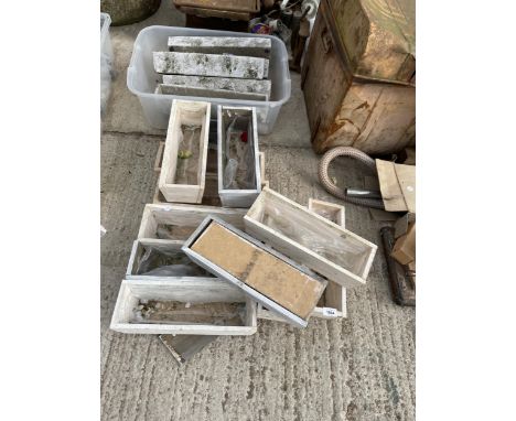 A COLLECTION OF SMALL WOODEN TROUGH PLANTERS