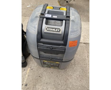 A STANLEY TWO WHEELED PLASTIC TOOL BOX