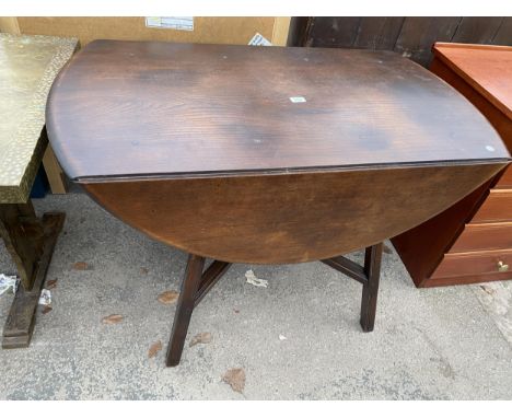 AN ERCOL BLUE LABEL OVAL DROP LEAF DINING TABLE, 48" X 44" OPENED