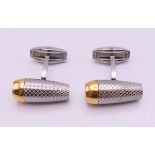 A pair of cufflinks stamped AP and Audemars Piguet. 2.25 cm long.