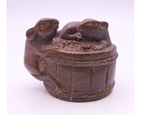 A netsuke formed as mice on a barrel.  3 cm high. 