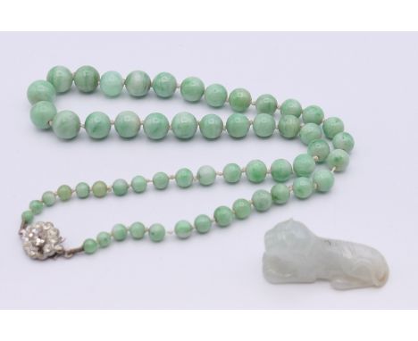 A jade bead necklace and a jade tiger form pendant.  Bead necklace 42 cm long, pendant 3.5 cm long.  
