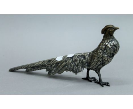 A vintage silver plated model of a pheasant with glass eyes. 27 cms long. 