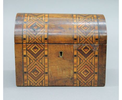 A Victorian inlaid walnut tea caddy. 17.5 cm wide.