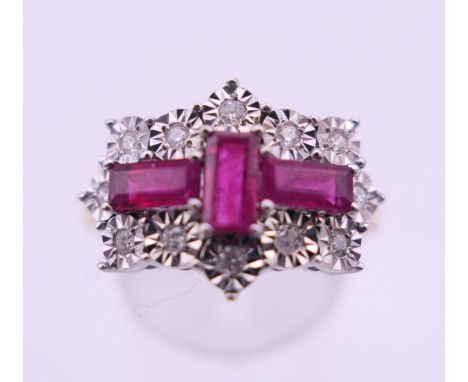 A 9 ct gold ruby and diamond ring. Ring size P. 3.4 grammes total weight.