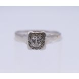 An 18 ct white gold and platinum illusion set diamond solitaire ring. Ring size L/M. 2.