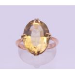 A 9 ct gold citrine ring. Ring size I/J. 4.4 grammes total weight.