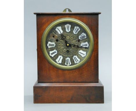 A Victorian mahogany mantle clock. 28 cm high.
