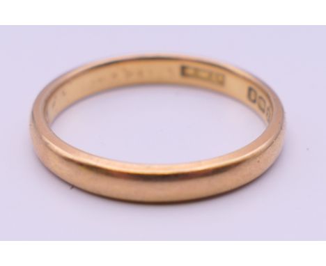 A 22 ct gold wedding band. Ring size M. 3.4 grammes.