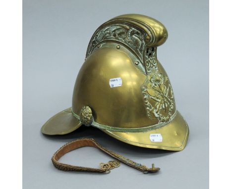 A vintage brass fireman's helmet. 26 cms high. 