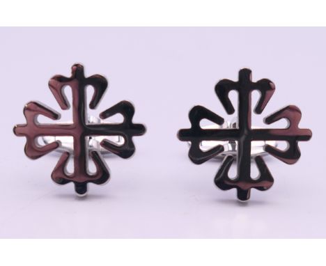 A pair of Patek Philippe clover form cufflinks.  2 cm diameter.