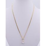 A 14 K gold two stone pendant necklace. Chain 44 cm long, pendant 1.5 cm high. 5.