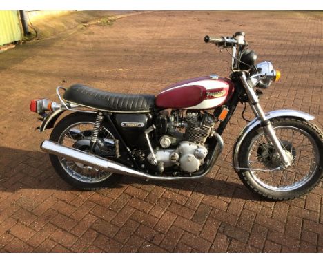 EXTRA LOT:  A 1975 Triumph T160 Trident, registration number LFM 738N, frame number T160BK02036, red/white.  Triumph's handso