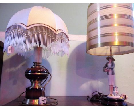 A Florence figural table lamp in the form of a lady in 1940's costume, together with a turned wood and gilt table lamp, with 