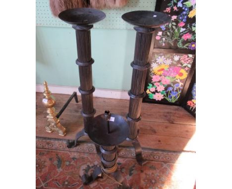 A pair of blacksmith made pricket alter candlesticks and a corresponding blacksmith made table lamp.