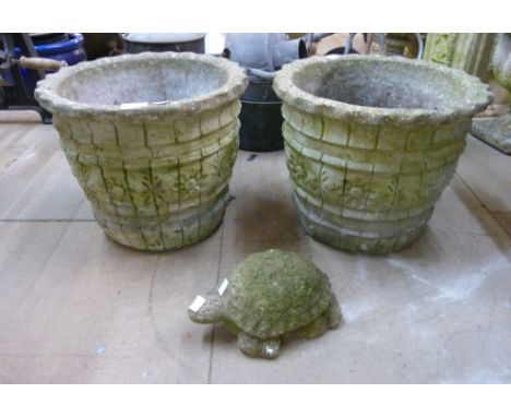 A pair of concrete planters and a concrete garden figure of a tortoise 