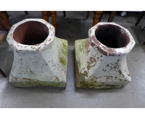 A pair of terracotta chimney pot bases and a set of painted step ladders 