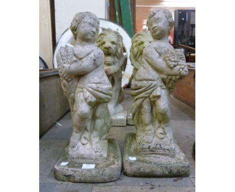 A pair of concrete garden figures of cherubs 