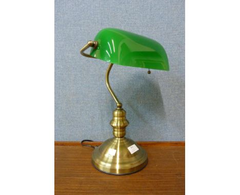 A brass student's desk lamp 