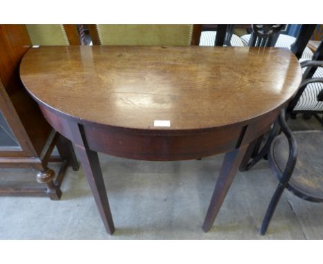 A George III mahogany demi-lune console table 