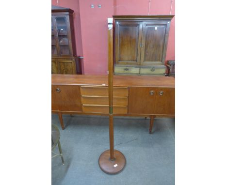 A teak standard lamp 
