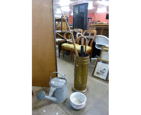 A brass stick stand, a galvanised watering can, etc. 