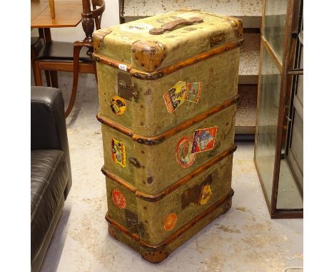 An early 20th century slat and leather-bound travelling trunk, with labels, W90cm 