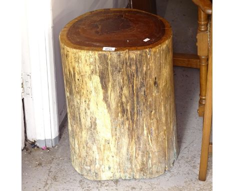 A petrified wood tree trunk side table, W38cm, H52cm 