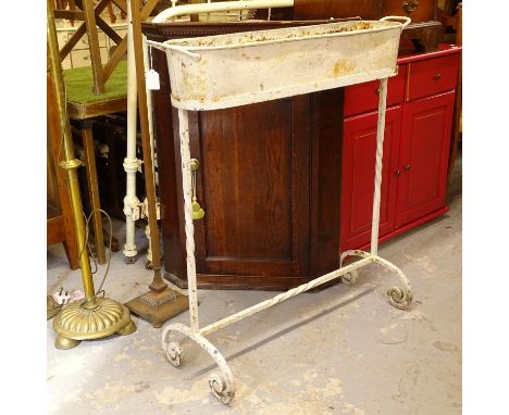 A painted cast-iron garden planter on stand, W90cm, H96cm 