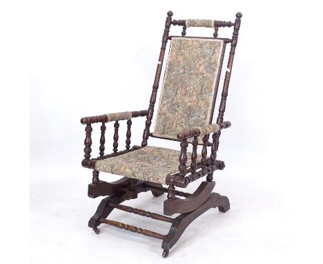 An American stained beech rocking chair, with tapestry upholstery 