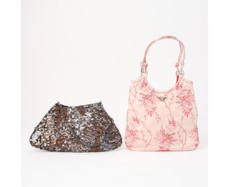 Sequins and satin cherry blossoms, both signed Prada. 8 x 7 1/2 and 9 1/2 x 5 inches. Some wear to top handles. 