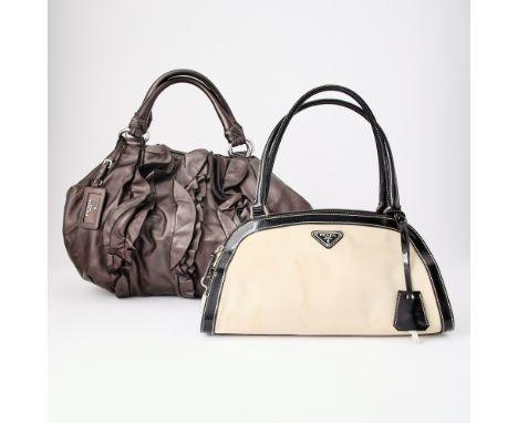 Beige nylon with black patent leather trim and chocolate brown metallic leather, silver-tone hardware, both signed Prada. 19 