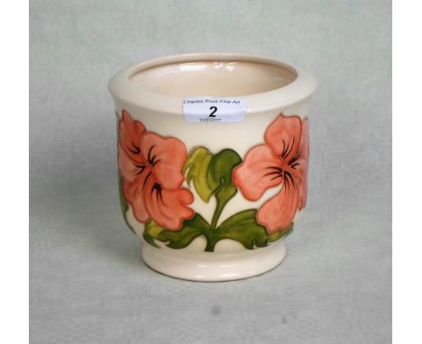 A Moorcroft planter in the Peach Hibiscus pattern, having tube-lined decoration on a cream ground, painted and impressed mark