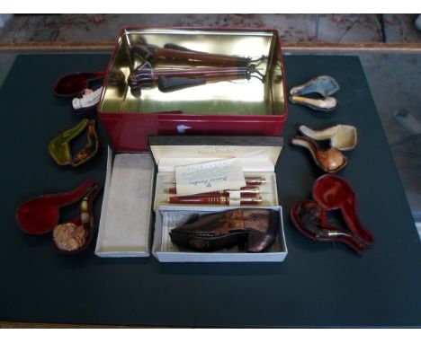 A mixed lot, to include: cased meerschaum pipes, a boxed Ronson gilt metal propelling pencil, two bone needle cases and other
