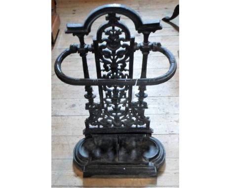 A late Victorian cast metal stick stand, having pierced foliate decoration, 67cm tall.