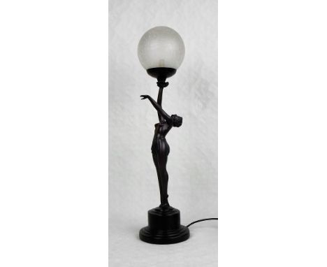 An Art Deco-style figural table lamp, modelled as a dancer holding aloft the globe, on stepped circular base, 66cm.