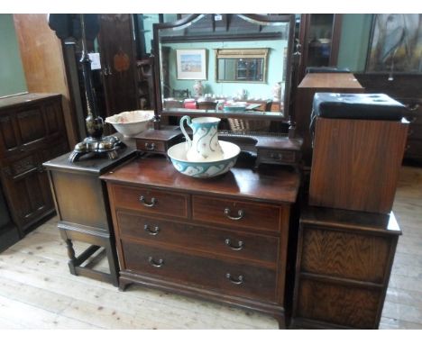 An Edwardian mahogany and inlaid dressing chest, having swivel mirror over twin trinket drawers and shelf, 107cm wide.