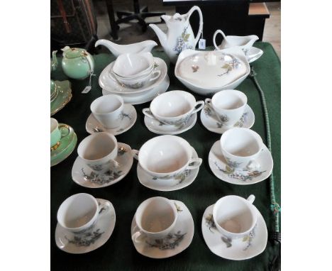 A mid-20th century Midwinter Orchard Blossom pattern part-dinner service, comprising: vegetable tureen, coffee pot, cups & sa