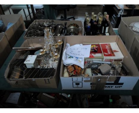 Four boxes containing assorted items to include: metalware goblets and tankards, dressing table items, a contemporary carriag