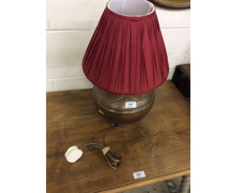 A copper table lamp and shade 